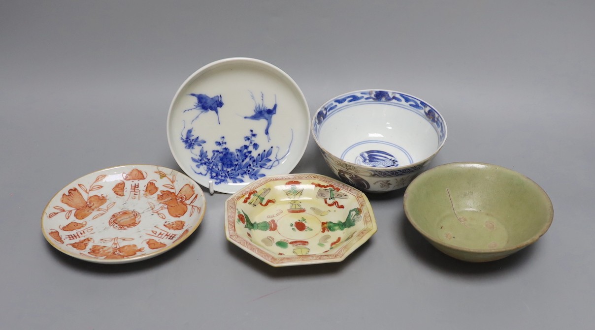 A Korean celadon bowl, a Chinese blue and white bowl, an iron red dish a famille Verte saucer and a Japanese blue and white saucer